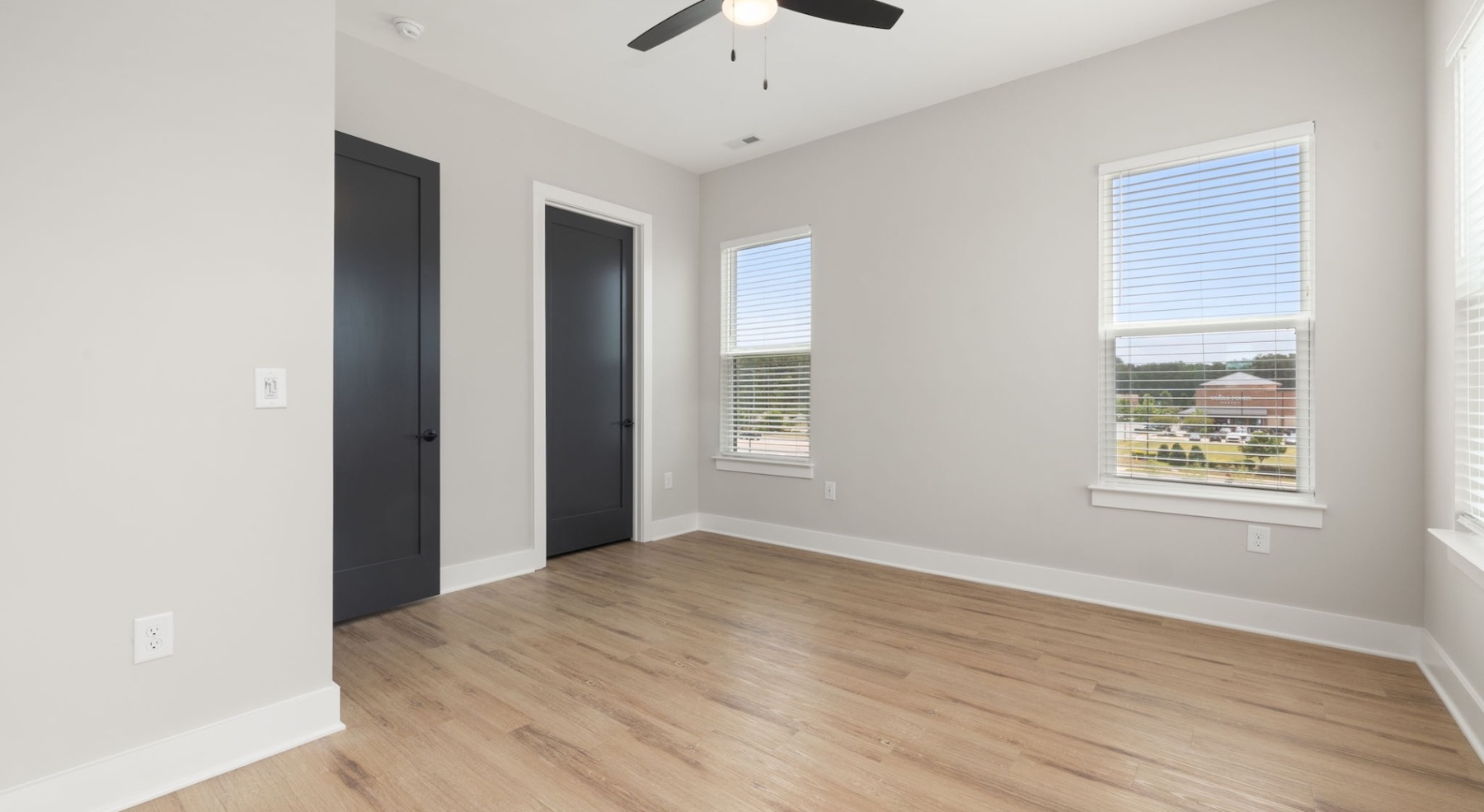 Bedroom with natural lighting and high ceilings