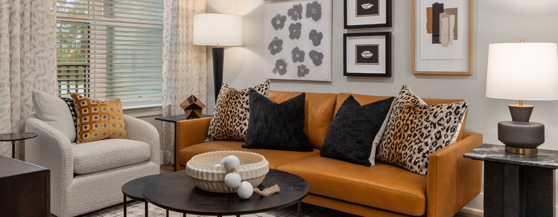 living room with seating table and windows