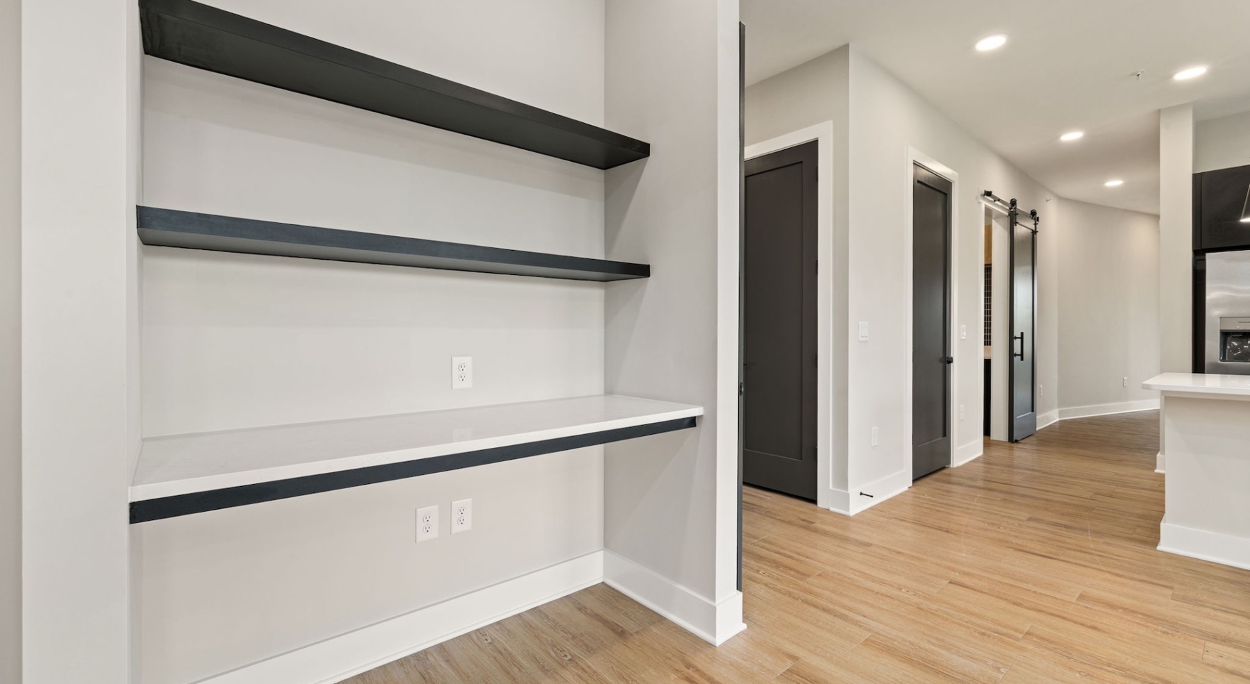 a thoughtful nook and shelves near the kitchen