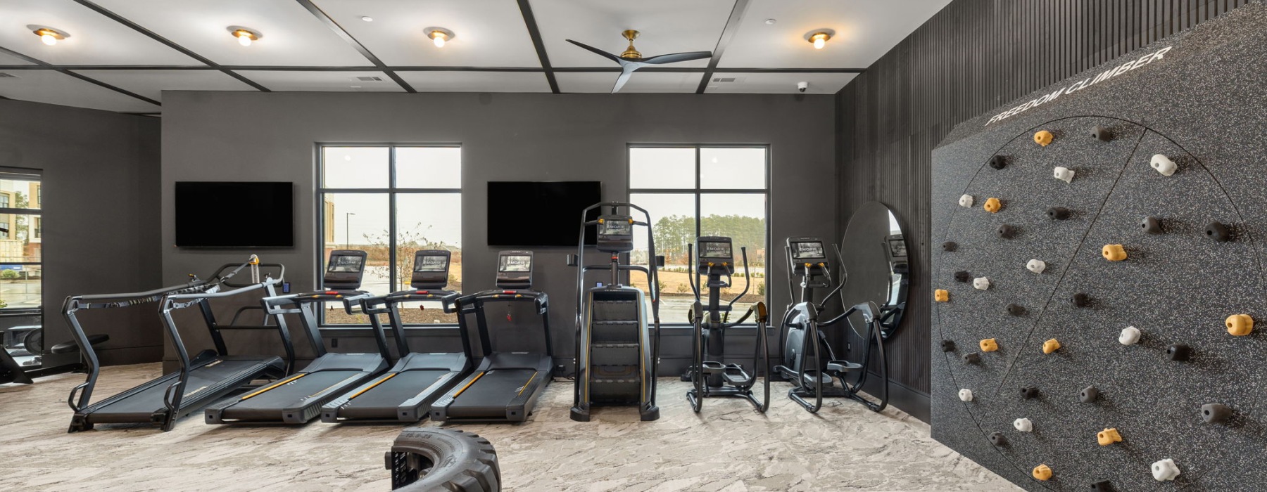 Fitness center with cardio machines at Emorie apartments.