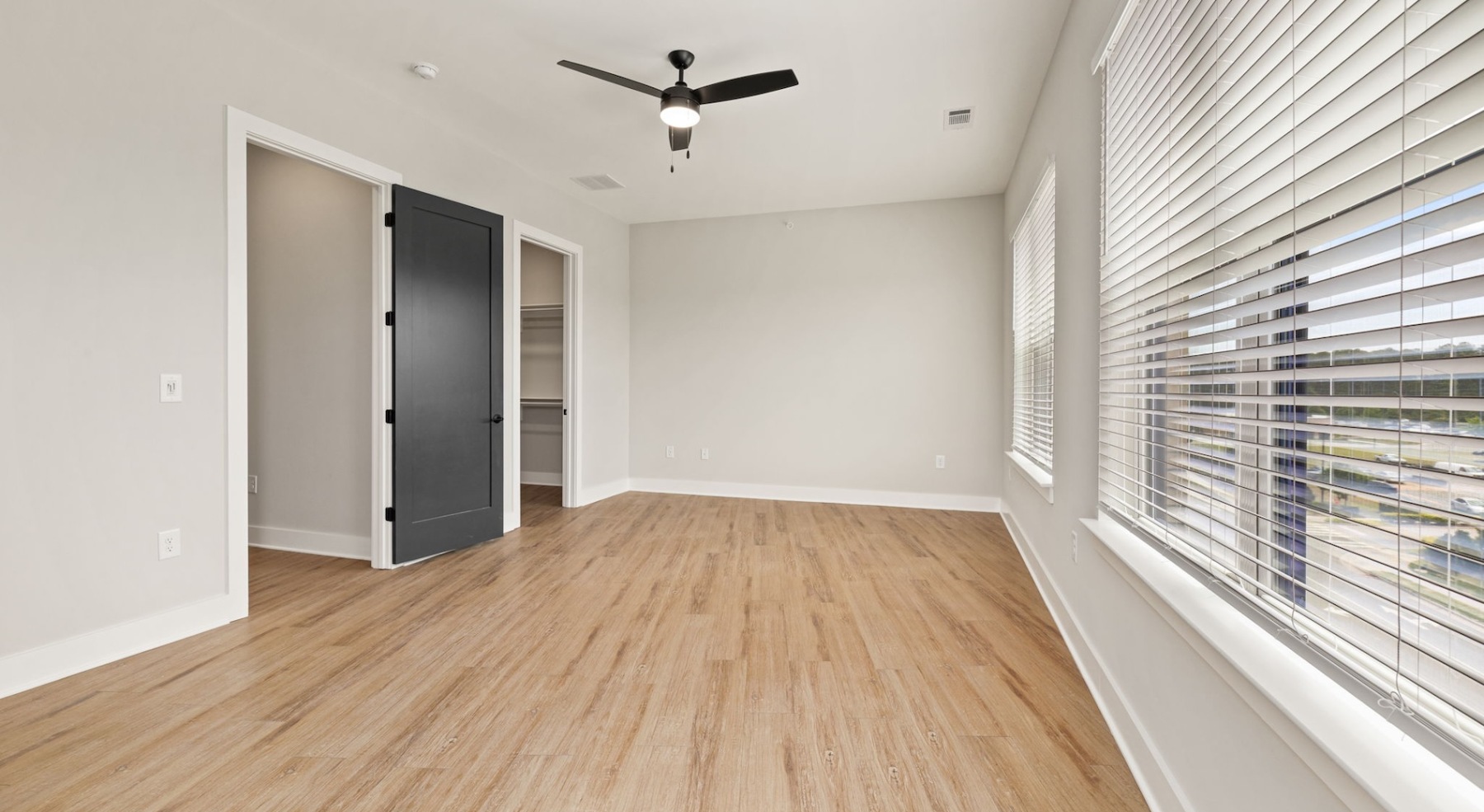 Bedroom with natural lighting and high ceilings